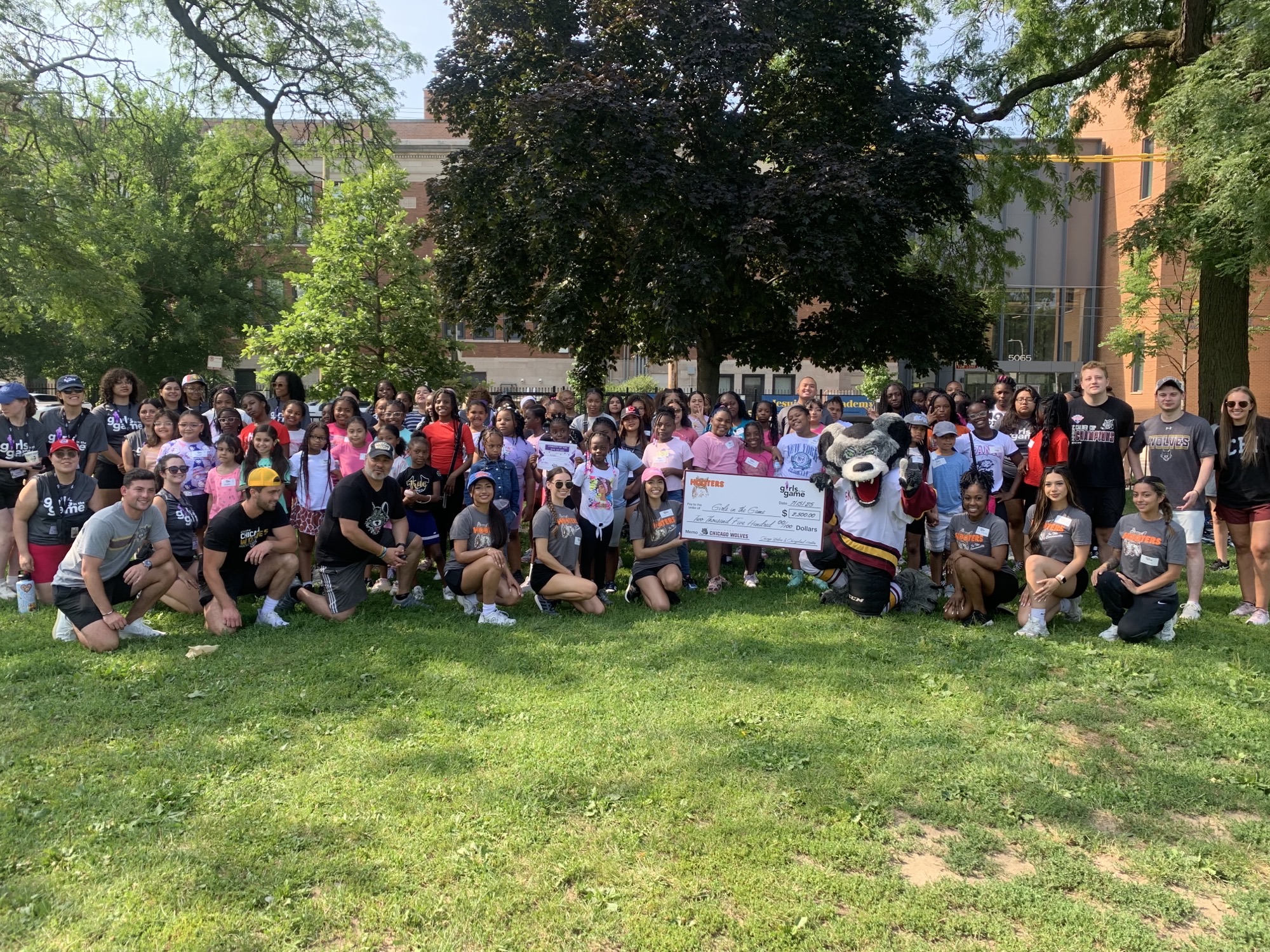 Girls in the Game - Full Group - Hooters Charity Donation - Chicago Wolves